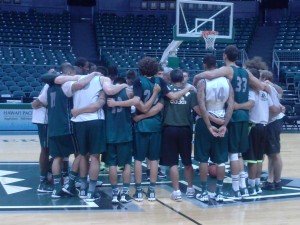 UH huddled up at the end of Monday's practice.