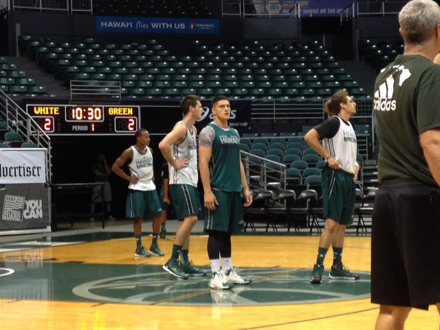 Forward Sammis Reyes (in green) got in on a full UH practice for the first time on Tuesday.