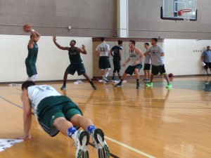 Only a few UH bigs could take the court. In the foreground, Sammis Reyes did push-ups.