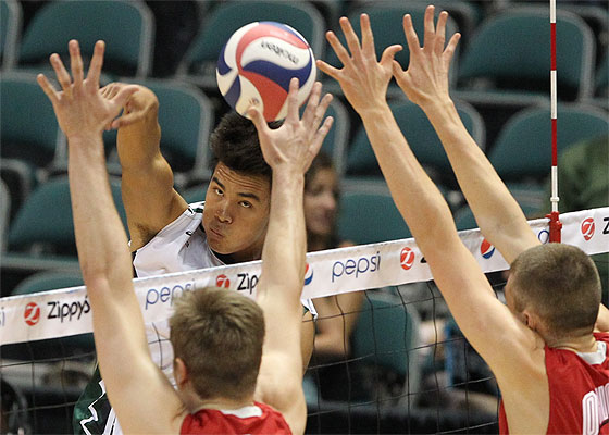 Hawaii outside hitter Kupono Fey (21) follows his kill attempt in the game between the Ohio State Buckeyes and the Hawaii Rainbow Warriors at the Stan Sheriff Center. Darryl Oumi / Special to the Star-Advertiser
