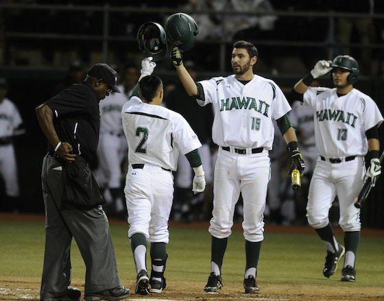 Kaeo Aliviado bumped helmets with Alex Sawelson after launching his fifth home run of the season Saturday night. Photo by Bruce Asato/Star-Advertiser.