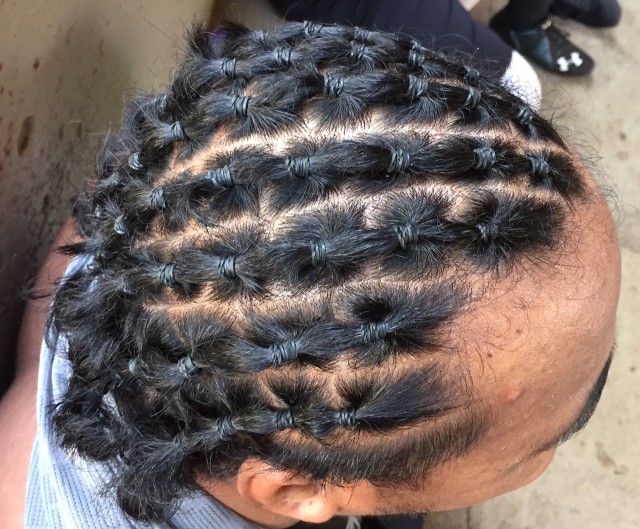 Nose tackle Kiko Faalologo's braids