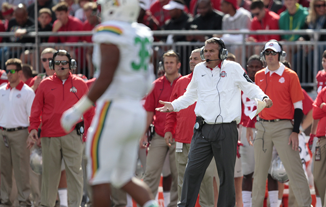 Ohio State head coach Urban Meyer gestured from the sideline in the first half Saturday against the Rainbow Warriors.