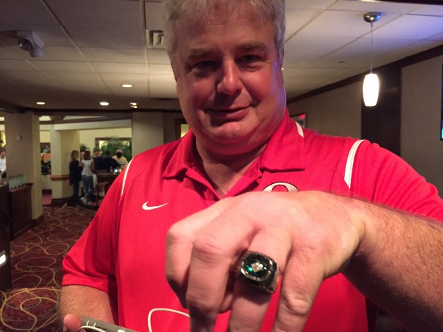 Former UH assistant Todd Murgatroyd shows his 1992 Holiday Bowl ring. 