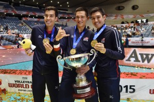 Hawaii's Kawika Shoji, Micah Christenson and Erik Shoji hold the FIVB World Cup the U.S won Wednesday in Tokyo