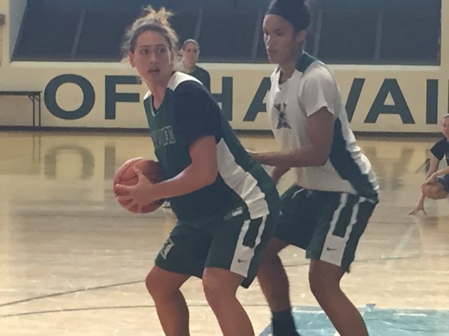 Kalei Adolpho works against Briana Kennedy in the Rainbow Wahine basketball team's practice on Thursday.