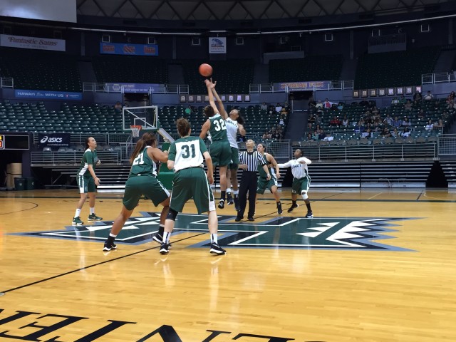 Kalei Adolpho (32 green) and Connie Morris tip off the Rainbow Wahine basketball team's Green vs. White scrimmage at the Stan Sheriff Center on Friday.