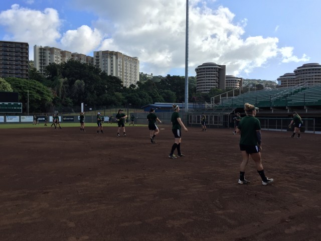 The Rainbow Wahine softball team warms up to start its first official practice of the spring on Saturday morning.