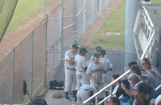 Hawaii talking some last-minute strategy before the opener against UH-Hilo.
