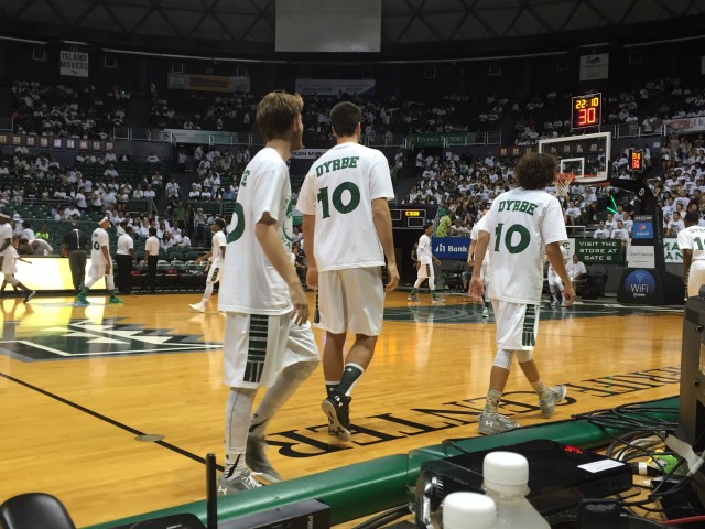 UH players warmed up in "Aloha State Warriors" shirts for the outgoing Dyrbe Enos on senior night.