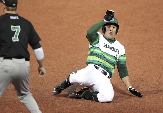 Marcus Doi slid into third base for a triple in the seventh inning of a Game 3 win over Chicago State. Photo by Jamm Aquino/Star-Advertiser.