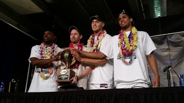 Head coach Eran Ganot and players Roderick Bobbitt, Stefan Jankovic and Aaron Valdes posed with the Big West tournament trophy Saturday night.