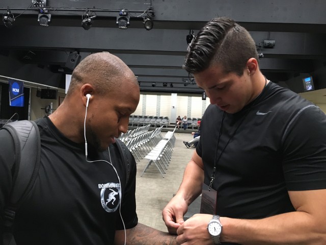 Defensive back Ne'Quan Phillips and his West Coast trainer, former UH linebacker Brenden Daley