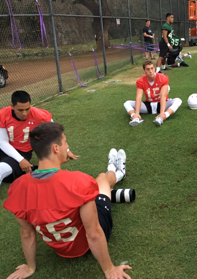 Quarterbacks Ikaika Woolsey (11), Beau Reilly (16) and Aaron Zwahlen (15).