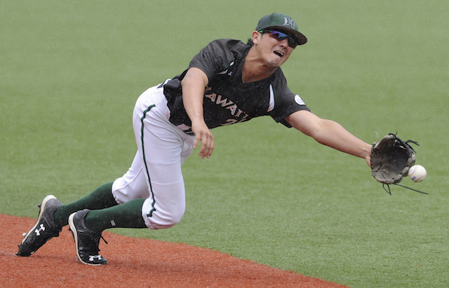 Hawaii second baseman Josh Rojas dove for a ball in a game against Cal Poly this year. Photo by Bruce Asato/Star-Advetiser.