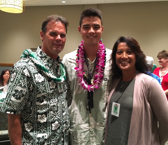 Outside hitter Kupono Fey with parents Kyle and Shelley Fey