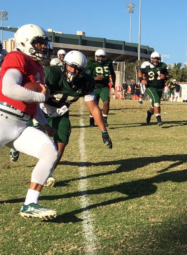 Quarterback Ikaika Woolsey heads for the end zone