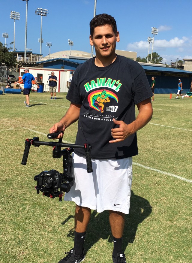 Football is a game played on the ground, and UH has revived shooting video from field level. While Ben Yee (with toothpick dangling from his mouth) used a camcorder back in the Tomey/Wagner era, the Warriors now use a stabilizer that shoots footage that does not appear to be shot by a TMZ photog chasing after a Kardashian.