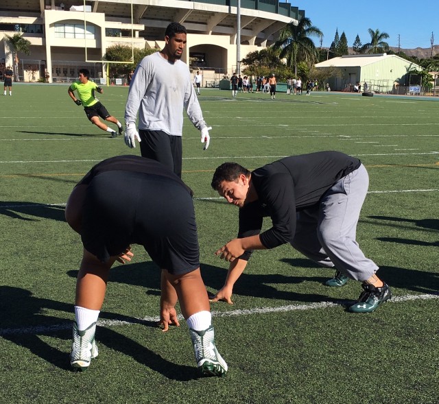 Defensive tackle Kory Rasmussen demonstrating a technique