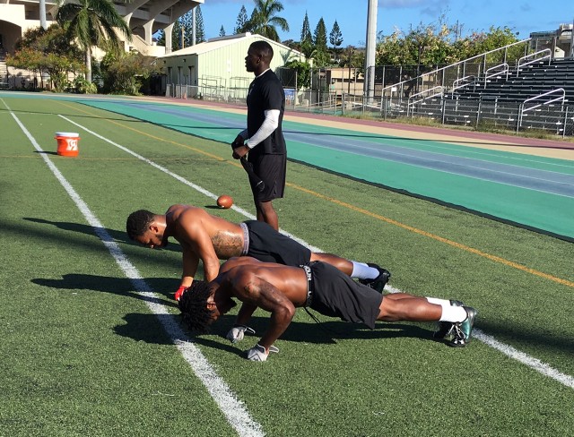 Daniel Lewis (front), safety Damien Packer (middle) and cornerback Jamal Mayo (standing)