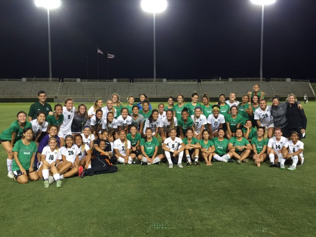 Current and former players posed together after the 2016 Rainbow Wahine won the annual alumnae game 5-0.