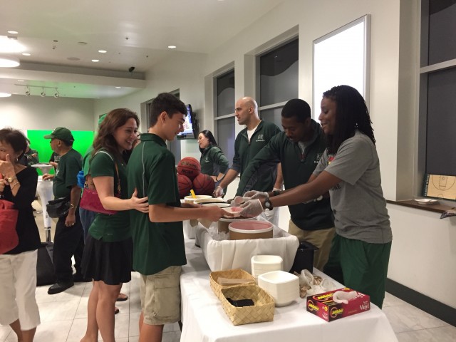 UH assistant coaches Calamity McEntire, Alex Delanian, Brad Langston and director of operations Teneshia Ruff greet fans at the ice cream social prior to the scrimmage.