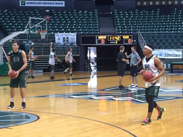 Drew Buggs (right) got up shots during warmups for Friday's team practice.