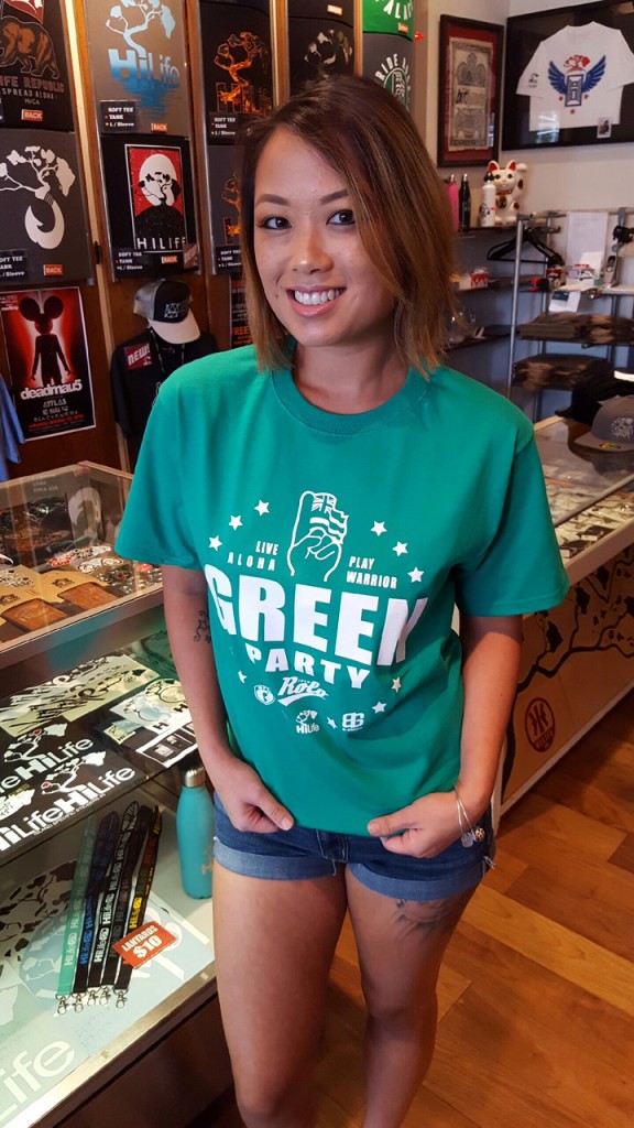 Jerelle Chun of the Butigroove store displays the Green Party T-shirt. 