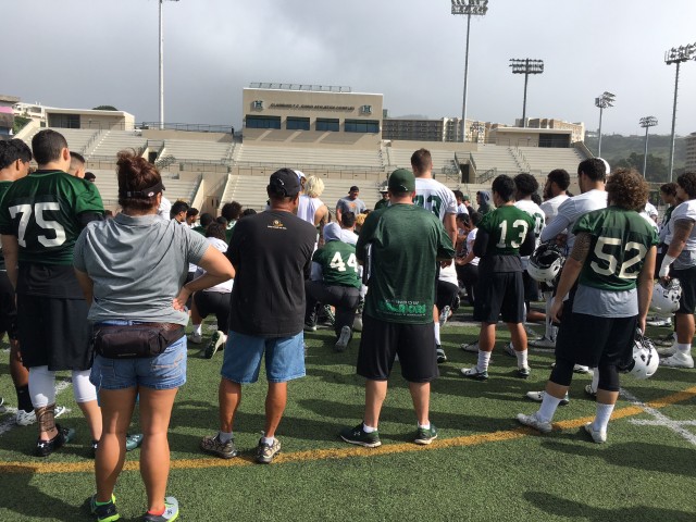 Chris Brown speaks to the team after today's practice 