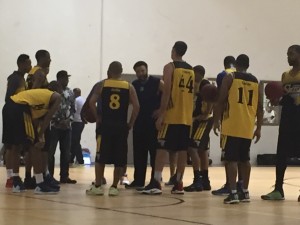 Hawaii hoops alum Artie Wilson gave the new Hawaii Swish squad pointers in a team huddle in December.