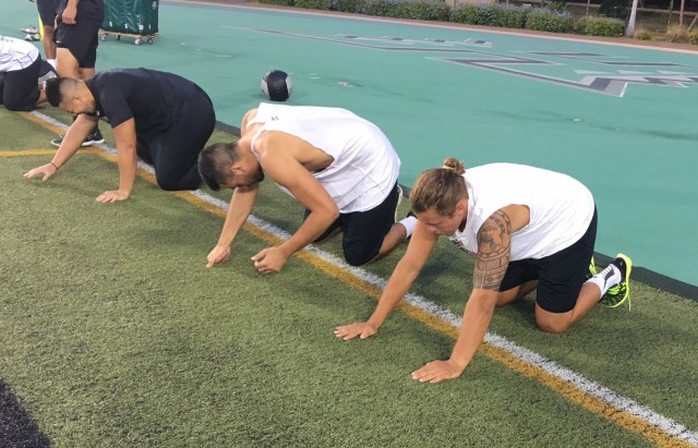 Linebacker La‘akea Look, Sione Kauhi and Max Broman