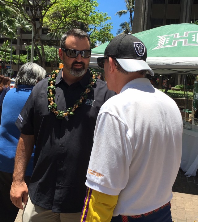 Nick Rolovich (a lifelong 49er fan) chats with an apparent Las Vegas Raider fan